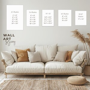 May include: A living room scene with a cream-colored sofa, pillows, and a woven rug. The wall displays art print size guides in inches, including 4x6, 8x12, 12x18, 16x24, and 20x30. The text "WALL ART Sizing" is also visible.