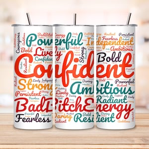May include: Three white tumblers with colorful word clouds. The words on the tumblers include "Confident", "Ambitious", and "Energy".