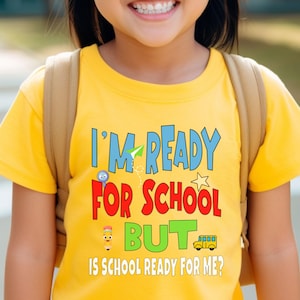 yellow kids crewneck t-shirt that reads “I’m ready for school but is school ready for me?” in colorful letters with fun icons.