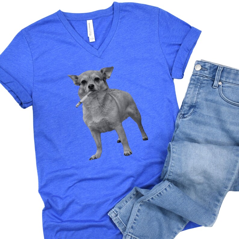 A royal blue unisex vee-neck t-shirt featuring a grayscale image of a Chihuahua standing with a cigarette in its mouth, giving a humorous, meme-style look perfect for dog lovers and fans of funny novelty shirts.