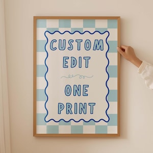 May include: A rectangular wall print in a wooden frame featuring a light blue and white checkered background. The center displays a white scalloped border containing the blue text CUSTOM EDIT ONE PRINT with a small decorative swirl line below.