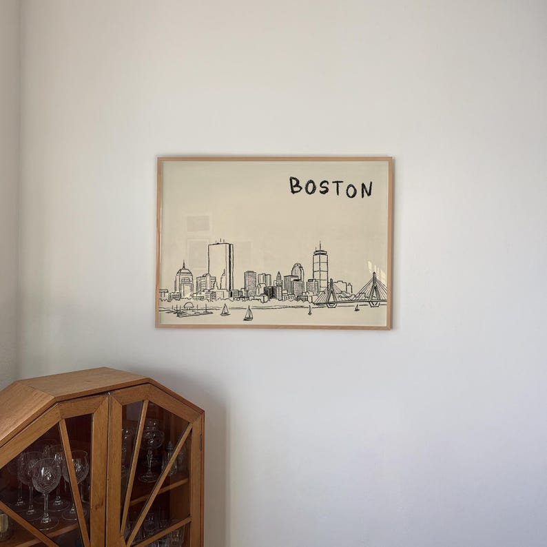 Minimalist hand-drawn sketch of Boston skyline in black ink on a beige background, organic modern wall art style.