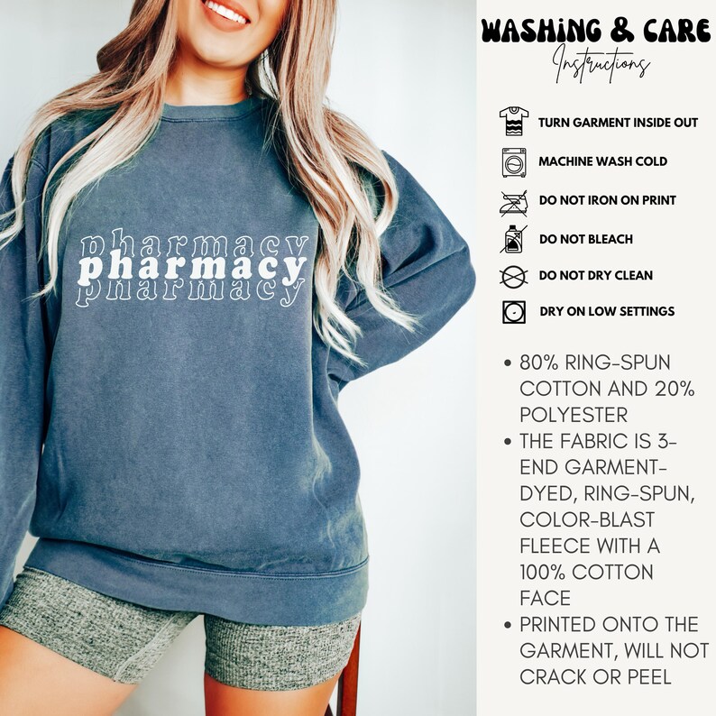 May include: A dark blue sweatshirt with the text "pharmacy" printed on it in white. The sweatshirt has a distressed look and is made of 80% ring-spun cotton and 20% polyester. The fabric is 3-end garment-dyed, ring-spun, color-blast fleece with a 100% cotton face. The print is printed onto the garment and will not crack or peel.