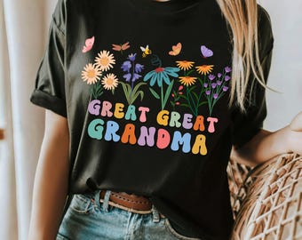 May include: Black t-shirt with a colorful floral design and the text "Great Great Grandma" in rainbow letters.