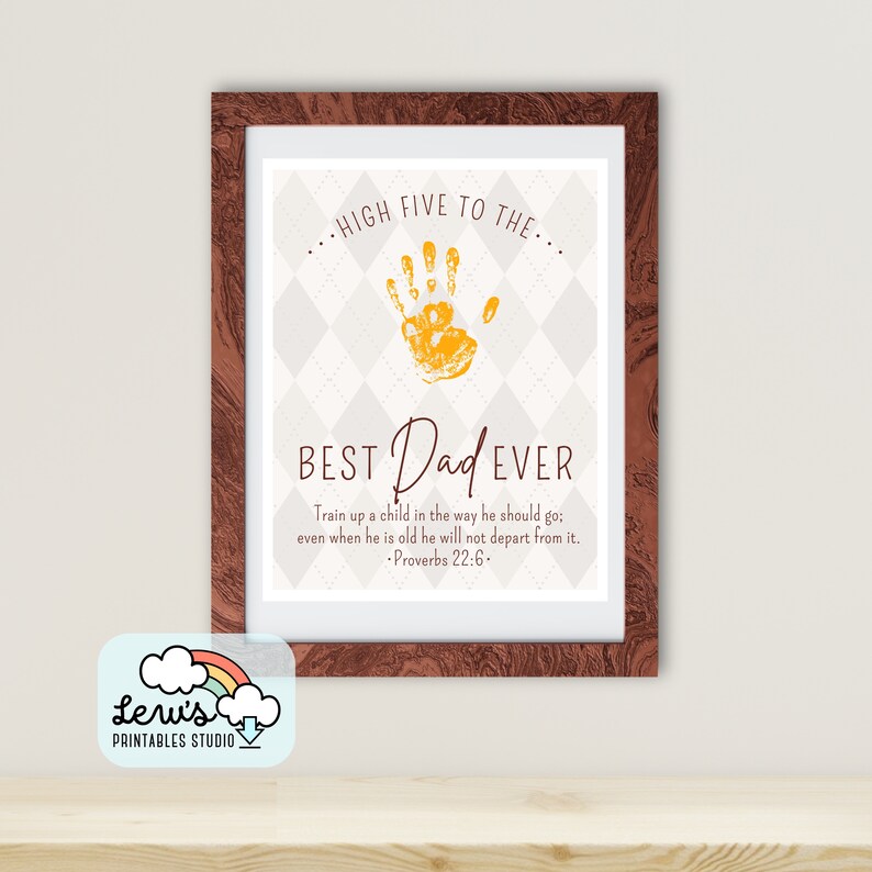 May include: A framed printable with a yellow handprint and the text "HIGH FIVE TO THE... BEST Dad EVER" with a Bible verse from Proverbs 22:6. The background is a white and grey checkered pattern.