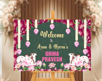 May include: Welcome to Arun & Heera's Griha Pravesh sign with a green background and floral design. The sign features two white cows with pink flowers and garlands.
