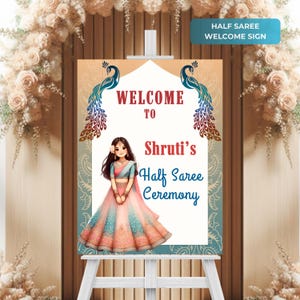 May include: Welcome sign for a half saree ceremony with a peacock design and a cartoon illustration of a girl in a pink and blue dress. The sign says "Welcome to Shruti's Half Saree Ceremony".