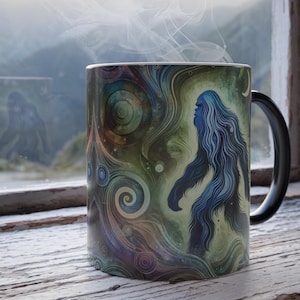 May include: A black coffee mug with a colorful design featuring a blue Bigfoot-like creature walking through a swirling galaxy pattern.