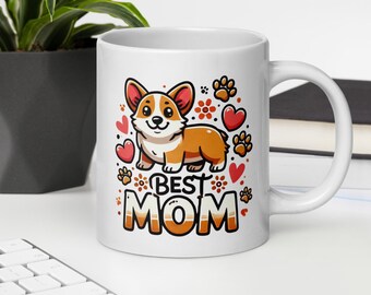 May include: White ceramic mug with a cartoon corgi dog and the text "BEST MOM" in red and orange letters. The dog is surrounded by red hearts, flowers, and paw prints.
