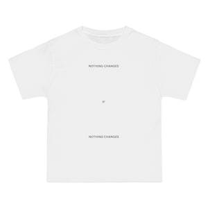 May include: White t-shirt with the text "NOTHING CHANGES IF NOTHING CHANGES" printed on the front.