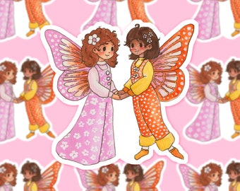 May include: Two fairies holding hands, one with pink and white wings and a pink and white dress, the other with orange and white wings and an orange and white dress.