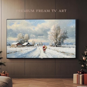 May include: A framed winter landscape painting featuring a snowy scene with a figure in a red suit carrying a sack. The artwork depicts a snow-covered road leading to a village with houses and trees. The text "PREMIUM FREAM TV ART" is at the top.