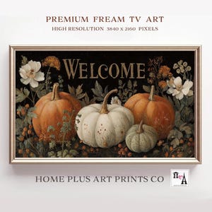 May include: A framed digital art print featuring a fall harvest scene. The artwork displays a black background with the word "WELCOME" in gold lettering. Pumpkins in shades of orange, white, and green are surrounded by flowers and foliage. The frame is a light gold color.