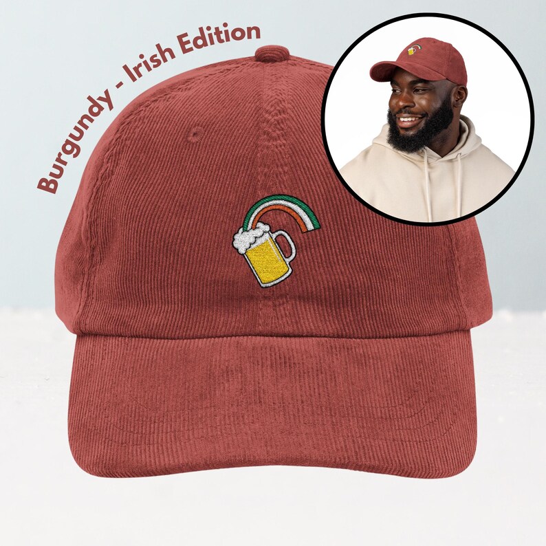 May include: Burgundy corduroy baseball cap with an embroidered beer mug and rainbow design. The text "Burgundy - Irish Edition" is printed on the side. A man wearing a similar cap is shown in a circular inset.
