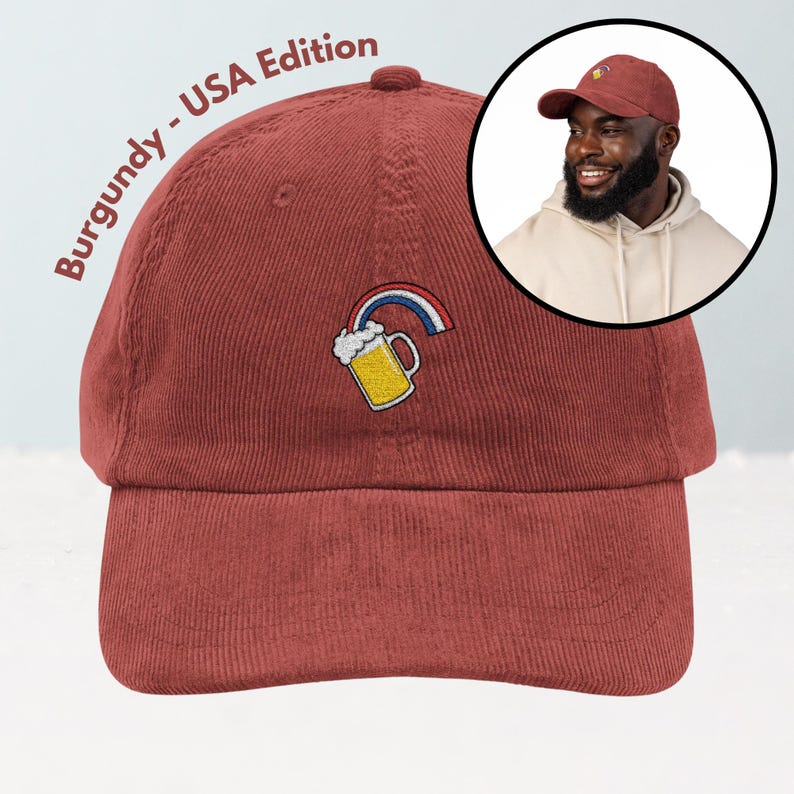 May include: Burgundy corduroy baseball cap with an embroidered beer mug and rainbow design. The text "Burgundy - USA Edition" is printed on the side. The cap has a curved brim and an adjustable strap.