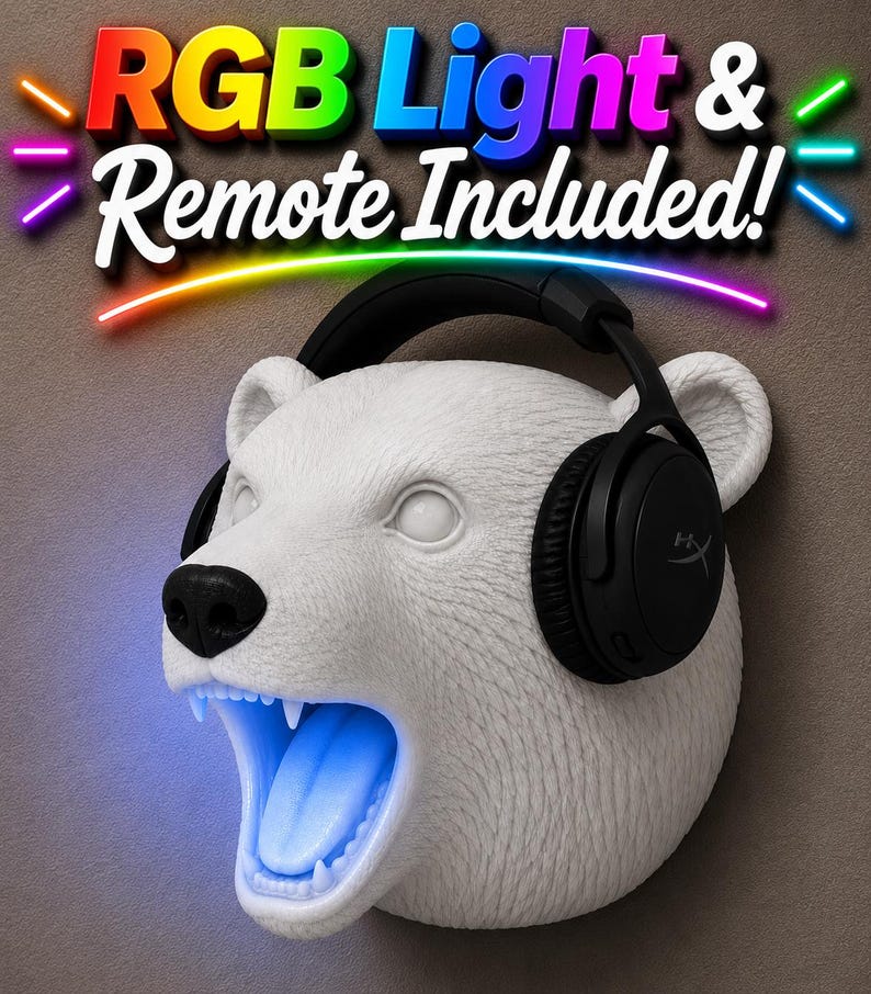 May include: A white polar bear head sculpture with black headphones and a glowing blue mouth. The text "RGB Light & Remote Included!" is displayed above the bear's head in colorful letters.