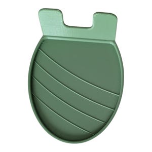 May include: A sage green silicone phone stand. The stand has a rounded base with four horizontal ridges and two rectangular tabs at the top. The stand is designed to hold a phone upright for hands-free use.