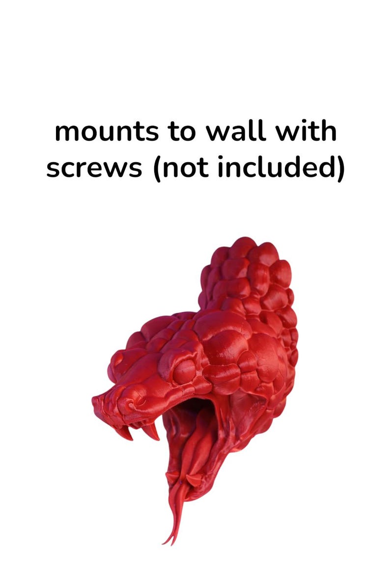 May include: A vibrant red snake head sculpture with an open mouth and forked tongue. The sculpture is designed to mount to a wall. The text "mounts to wall with screws (not included)" is above the sculpture.