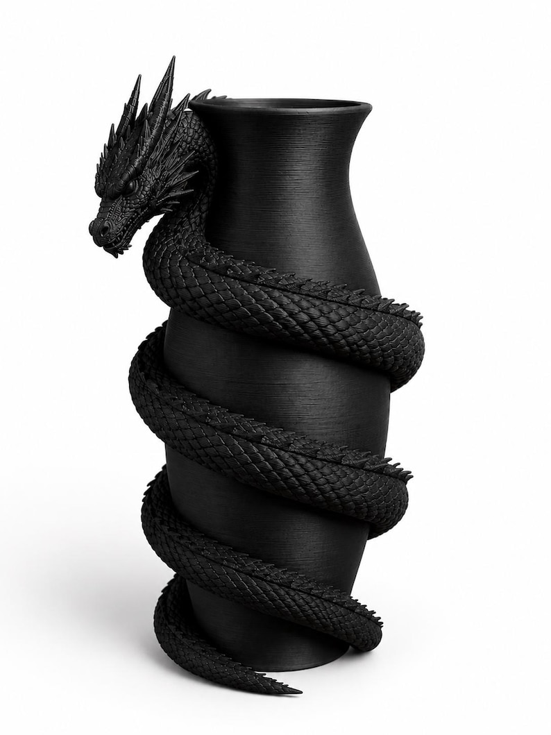 May include: A black vase with a dragon wrapped around it. The dragon's head is at the top, and its body coils down the vase. The vase has a textured surface, and the dragon is intricately detailed.
