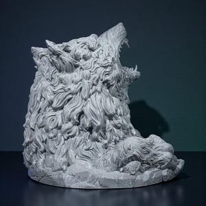 May include: A gray sculpture of a wolf's head, with its mouth open in a roar. The sculpture has detailed fur and sits on a rocky base. The background is a dark teal color.