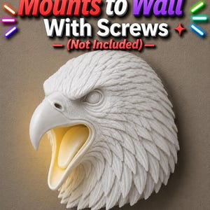 May include: A white eagle head wall mount with an open beak, revealing a warm yellow interior. The sculpture features detailed feather textures and the text "Mounts to Wall With Screws (Not Included)".