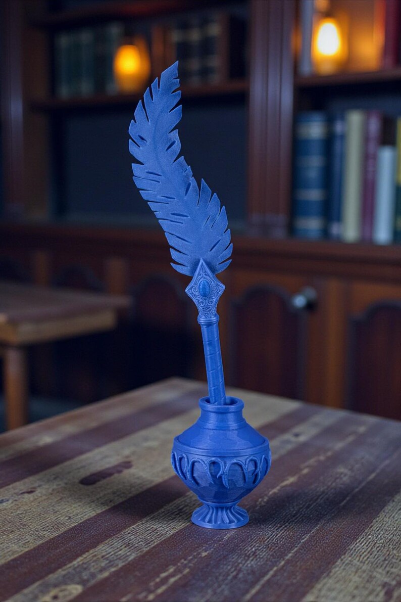 May include: A blue inkwell with a decorative feather quill. The inkwell has a detailed, ornate design and sits on a wooden table. The feather quill is upright, and the background includes a bookshelf and warm lighting.