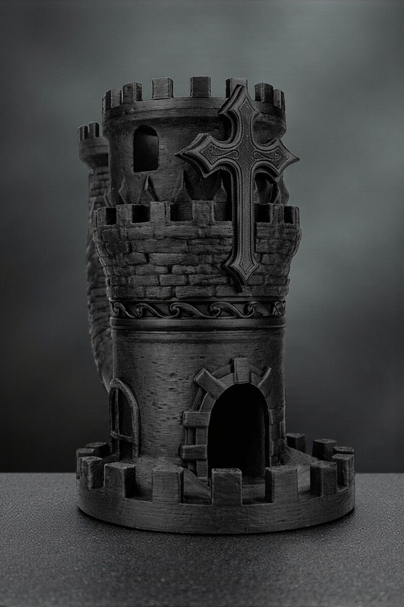 May include: A detailed, black castle tower with a prominent cross design. The tower features crenelated battlements, arched windows, and a textured brickwork appearance. The cross is centrally placed, adding a religious element to the design. The overall aesthetic is gothic.