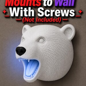 May include: White polar bear head wall decor with open mouth and blue LED light. The bear has a black nose and visible teeth. The text "Mounts to Wall With Screws (Not Included)" is at the top.