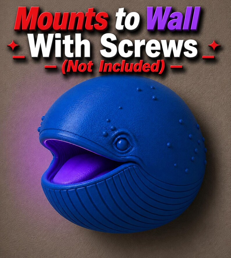 Op de afbeelding: Een blauwe walvisvormige wandlamp met een paarse gloed die uit zijn open mond komt. De tekst "Mounts to Wall With Screws (Not Included)" staat boven de walvis.