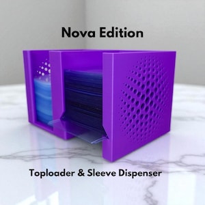 May include: A purple card toploader and sleeve dispenser. The dispenser has a geometric design on the side and the text "Nova Edition" and "Toploader & Sleeve Dispenser". The dispenser is designed to hold and dispense trading card sleeves and toploaders.