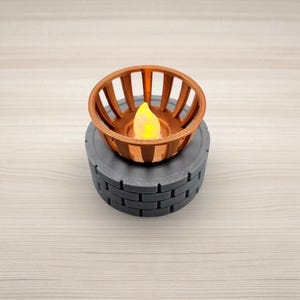 May include: A decorative candle holder with a copper-colored, slotted basket design. It sits atop a gray, brick-patterned base. The candle inside has a yellow, flickering flame, creating a warm ambiance. The candle holder is a unique home decor item.