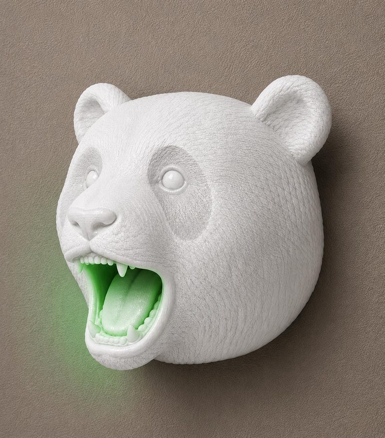 May include: A white panda bear head sculpture with an open mouth and green glowing interior. The sculpture has detailed fur texture and is mounted on a neutral-toned wall. The panda's mouth is open, revealing teeth and a green tongue.