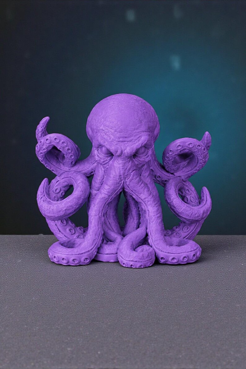 May include: A purple octopus sculpture with detailed tentacles and a textured surface. The sculpture has a stern expression and is set against a dark background. The octopus is a vibrant shade of purple.