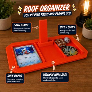 May include: An orange Roof Organizer for TCG. Features a card stand, dice and coin area, bulk card storage, and a spacious work area. Text on the organizer reads "Roof Organizer" and "For Ripping Packs and Playing TCG."