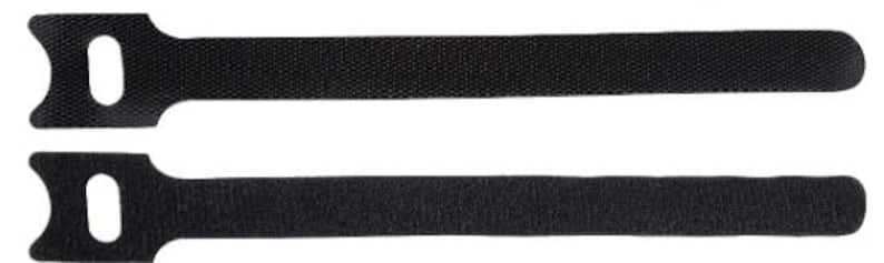 Puede incluir: Dos bridas de velcro negras. Cada brida tiene un cuerpo rectangular con una superficie texturizada y un extremo redondeado. Un extremo presenta una cabeza con un agujero para asegurar la brida.