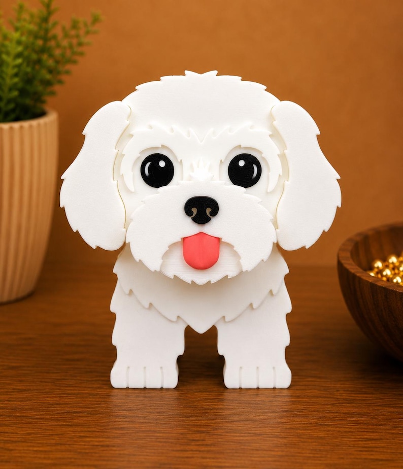 May include: A white, three-dimensional dog figurine with large black eyes, a pink tongue, and a black nose. The dog has fluffy-looking fur and is standing on a wooden surface. The background is a warm brown color.