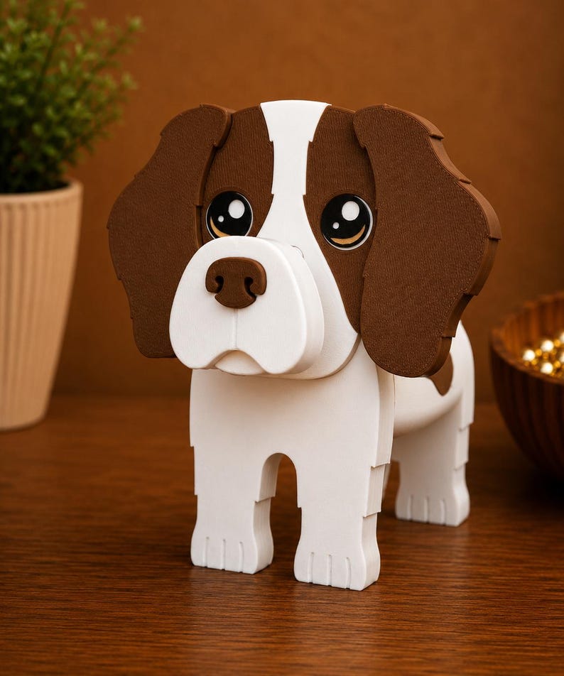 May include: A wooden dog figurine with a white body and brown ears and patches. The dog has large, expressive eyes and a white snout. The figurine is standing on a wooden surface.