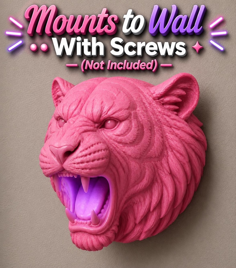 May include: A pink tiger head wall mount with an open mouth and visible teeth. The text "Mounts to Wall With Screws - (Not Included)" is above the tiger head. The tiger head is a decorative item.