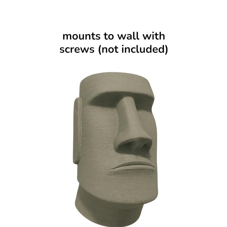 May include: A gray, textured Moai statue head, a replica of the iconic Easter Island sculptures. The statue has a prominent nose, defined facial features, and is designed to mount to a wall. The text in the image reads: mounts to wall with screws (not included).