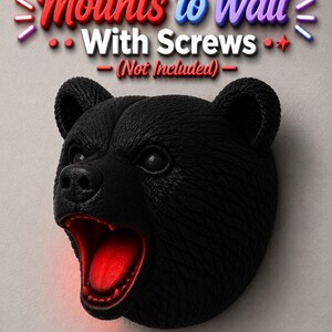 May include: Black bear head wall mount with an open mouth and red interior. The text "Mounts to Wall With Screws (Not Included)" is displayed above the bear's head. The bear head is a decorative item.