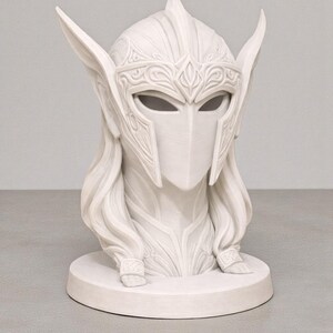 May include: A white bust depicting a helmeted figure with long hair. The helmet has detailed patterns and eye slits. The sculpture sits on a circular base, suggesting a fantasy or historical theme, crafted with intricate detail.