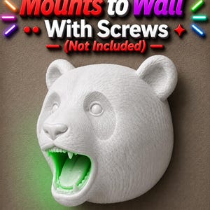 May include: A white panda bear head sculpture with an open mouth and green glowing interior. The text "Mounts to Wall With Screws (Not Included)" is above the sculpture. The sculpture is mounted on a brown surface.