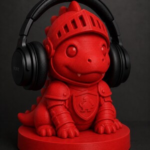 May include: A red dragon-shaped headphone stand with a knight's helmet and armor. The stand holds a pair of black Sony headphones. The dragon is sitting on a round base. The background is dark.
