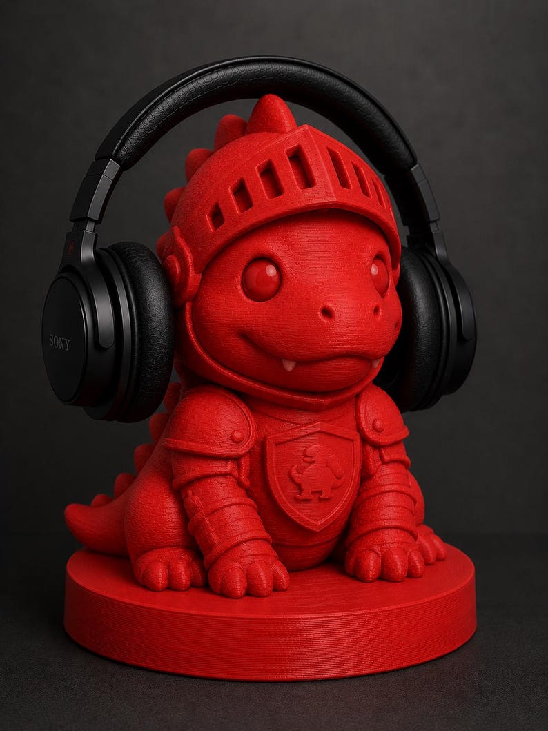 May include: A red dragon-shaped headphone stand with a knight's helmet and armor. The stand holds a pair of black Sony headphones. The dragon is sitting on a round base. The background is dark.