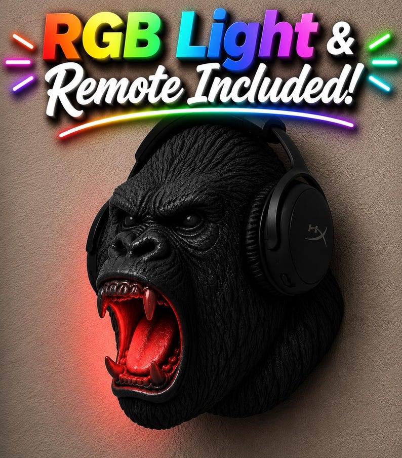 May include: A black gorilla head sculpture with red glowing mouth and teeth, wearing black headphones. The text "RGB Light & Remote Included!" is above the gorilla's head in colorful letters.