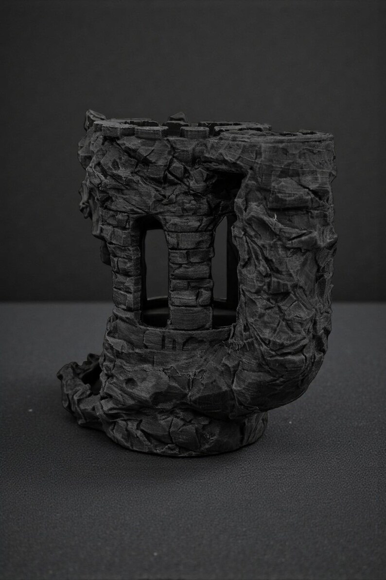 May include: A dark gray, 3D-printed miniature castle tower with a weathered, stone-like texture. The tower features arched windows and a cylindrical design, suitable for tabletop gaming or display.