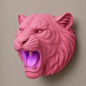 May include: A pink tiger head sculpture with an open mouth, revealing sharp teeth and a glowing purple interior. The sculpture is mounted on a neutral-toned wall, showcasing the detailed texture of the tiger's fur and facial features.