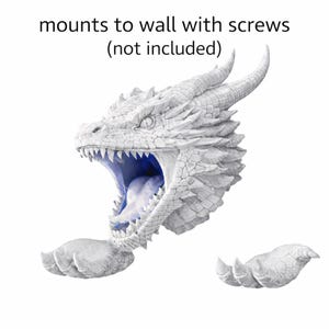 May include: A white dragon head wall mount with open mouth and sharp teeth. The dragon's mouth is blue, and the text "mounts to wall with screws (not included)" is above the dragon's head. Includes two dragon claws.