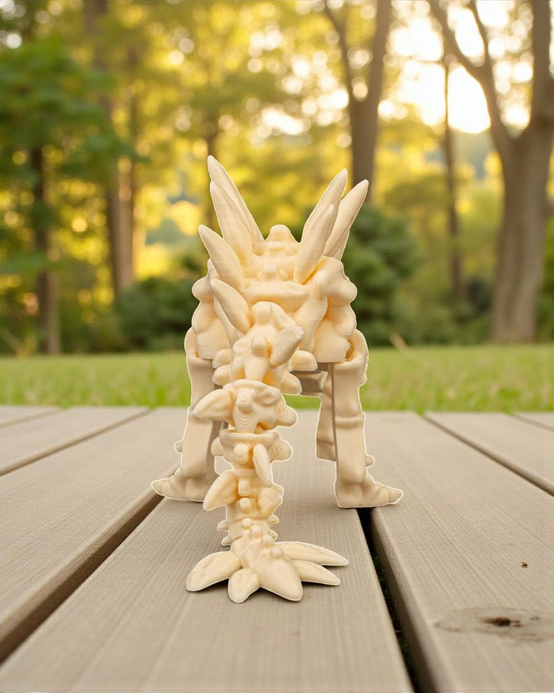 May include: A light beige, abstract sculpture with a complex, layered design. The sculpture has a central, upright structure with multiple protrusions and a smaller, detached piece in front. The sculpture is on a wooden deck.