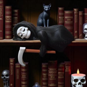 May include: A black Grim Reaper figurine with a white skull face and a scythe, resting on a shelf. A black cat figurine sits above the Reaper. The shelf is surrounded by antique books and other decorative items.